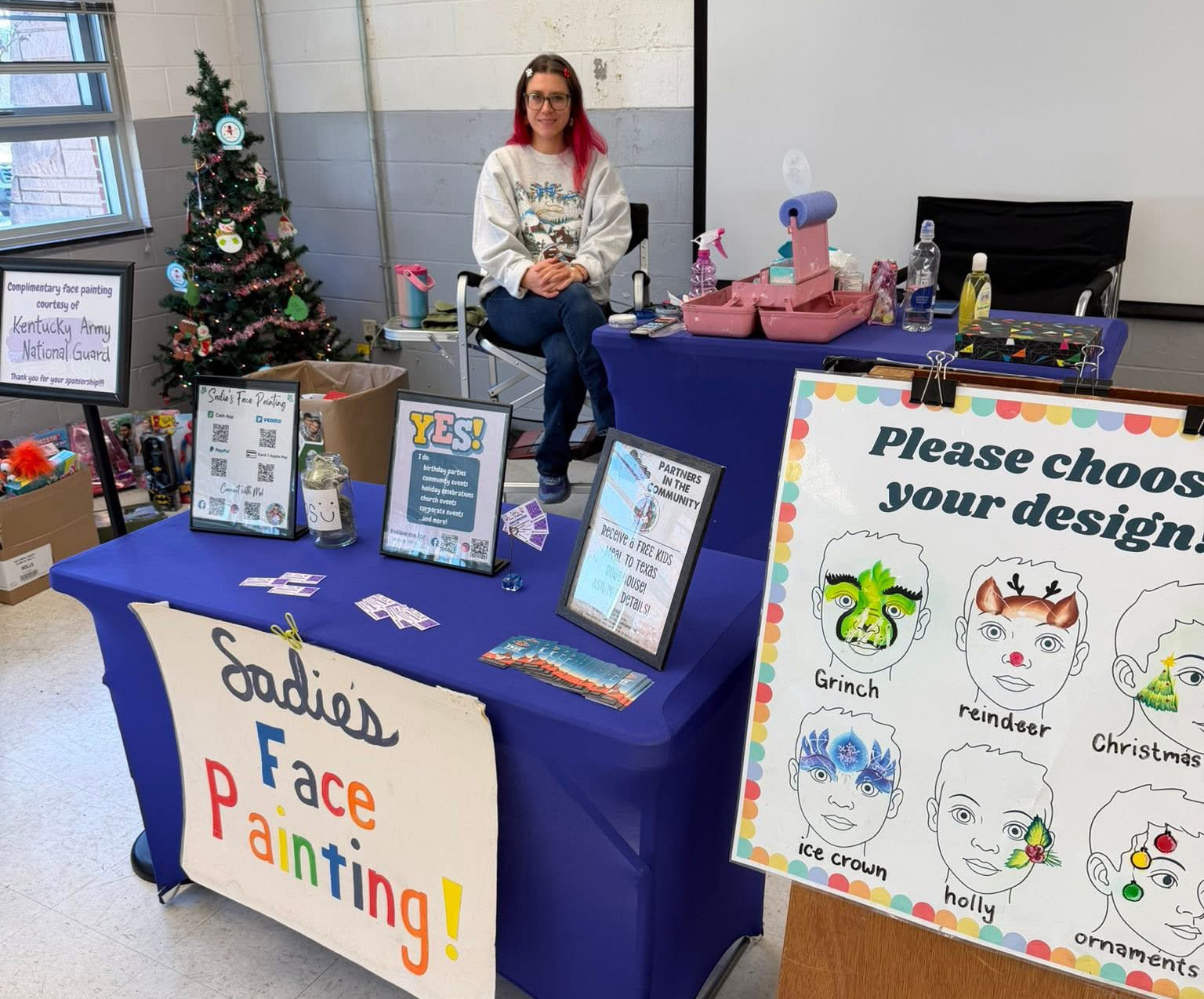 Sadie's indoor Christmas event setup with custom holiday design menu